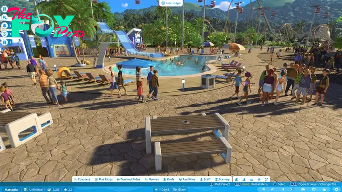 Planet Coaster 2 screenshot showing a guests meandering around a large plaza with a swimming pool and slide at its centre.