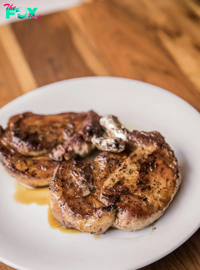 Pork chops on a plate | Source: Unsplash