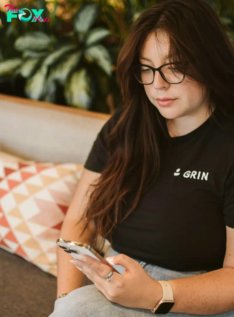 A woman sitting on a couch | Source: Unsplash