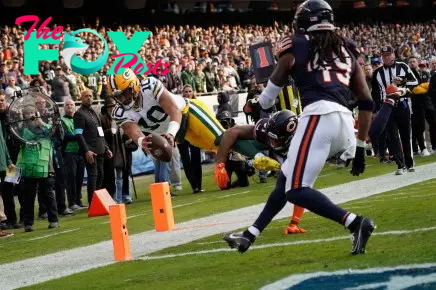 Nov 17, 2024; Chicago, Illinois, USA; Green Bay Packers quarterback Jordan Love (10) dives into the end zone against Chicago Bears safety Kevin Byard III (31) during the second half at Soldier Field. Mandatory Credit: David Banks-Imagn Images