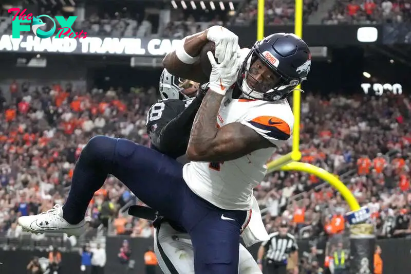 Nov 24, 2024; Paradise, Nevada, USA; Denver Broncos wide receiver Courtland Sutton (14) catches an 18-yard touchdown pass against Las Vegas Raiders cornerback Jack Jones (18) in the third quarter at Allegiant Stadium. Mandatory Credit: Kirby Lee-Imagn Images