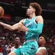 Hornets' LaMelo Ball makes eventful season debut: Buzzer-beating floater, behind-the-back dime, lots of fouls