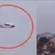 A UFO Hovers Over A City In Mexico As A Plane Flies Past