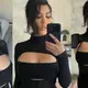Kourtney Kardashian References a Clᴀssic KUWTK Line as She Models Sєxy Black Cutout Look