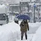 Snow piles deep in northern Japan, strands vehicles, 3 dead