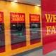 Wells Fargo 4Q profit falls by half but tops expectations