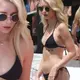 Kate Moss’ little sister Lottie flaunts model figure as she relaxes by the pool on sun-soaked Marbella holiday