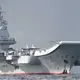 View In honor of its birthday, China’s first aircraft carrier, the Liaoning, is cruising while decked with 24 J-15 jets