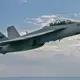 A US Navy F/A-18 Super Hornet Block III test fighter pilots three unmanned aerial vehicles (UAVs)