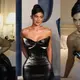 Kylie Jenner shows off her signature NSFW pose and pours out of plunging black gown as she lays in bed for Sєxy new pics