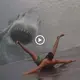 The camera captured the spectacle of a fearsome and enormous shark charging onto the beach and biting people, causing everyone to flee in terror (VIDEO)