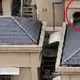 Terrifying moment kids spotted climbing steep roof of 15-storey apartment block