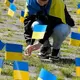 Ukraine flags block Russian ambassador's path on Victory Day