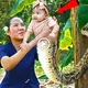 Mother still spoils the newborn mutant child that has a snake-tailed lower half of his body. (VIDEO)