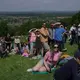 Rolling thunder: Contestants chase cheese wheel down a hill in chaotic UK race