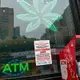 New York cracks down on unlicensed pot shops, but closing them might take time
