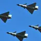 As Taiwan prepares for anti-invasion exercises, China sends dozens of warplanes toward the island