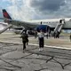 Tire on Delta flight pops while landing in Atlanta, 1 person injured, airline says