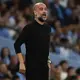 Pep Guardiola returns to Man City after emergency back surgery