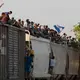Mexican railway operator halts trains because so many migrants are climbing aboard and getting hurt