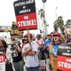 Hollywood writers reach 'tentative' deal with studios, end monthslong strike