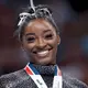 Simone Biles addresses viral video of young Black gymnast being snubbed a medal