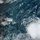 Philippe becomes a post-tropical cyclone as it drenches Bermuda en route to New England and Canada