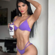 Stephany stuns in a captivating and seductive purple swimsuit
