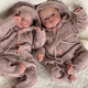Captivating Charm: Dark-Skinned Twin Babies with Uniquely Alluring Eyes Capture Hearts and Attention