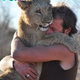 Heartwarming Bond: Lioness Embraces Rescuers, Forming Unlikely Friendship in Incredible Photos of Abandoned Big Cat