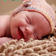 SES  “Joyful Charisma: Embracing the Enchanting Smile of Slumbering Newborns”