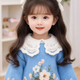 SES  “Elegant Charms: A Girl’s Enchanting Long Curls and Blue Attire Leave Lasting Impressions”