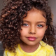 The irresistible allure emanates from the photo collection featuring girls with charming curly hair, resembling angels stepping out of fairy tales