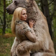 .Touching Reunion: Gray Bear Embraces Woman in North American Woods After 5-Year Separation, Demonstrating Unwavering Connection!..D