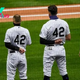 Why are MLB players wearing No. 42 on their jerseys today?