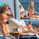 Brittany Mahomes sports tiny orange bikini on boat trip with her gal pals