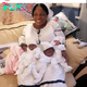 qq A 52-year-old mother welcomes triplets into her life after 17 years of embracing adoption, culminating in a heartwarming family moment filled with joyful amazement.