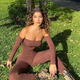 Zoe Garifallou in a tight outfit that hugs her beautiful body under the trees