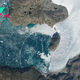Earth from space: Mysterious wave ripples across 'galaxy' of icebergs in Arctic fjord