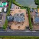 b83.”Tyson Fury’s VAST Gypsy King Logo Dominates the Drive at His Palatial £1.7 Million Lancashire Mansion – Surrounded by Caravans, Mobile Homes, Static Homes, and a Huge Lake”