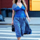 4t.Jennifer Lawrence captivates New York City in a dreamy blue dress paired with vibrant yellow mules.