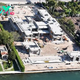 B83.Tom Brady took out a massive loan for his $17 million Miami mansion, nearing completion, while ex Gisele starts renovations on her own $11.5 million pad across the waterway, which she paid for outright.