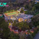 C5/Beverly Hills Mansion, Once Transformed Purple by Prince, Hits Market for $30 Million: Features Ten Bedrooms, Rooftop Tennis Court, and Grotto with Water Slide