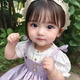 A cute little girl with captivating big, round eyes has taken the internet by storm. Her charming appearance and irresistible gaze have garnered millions of hearts, making her an instant favorite among viewers.