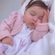 ”Peaceful moment of a newborn baby sleeping soundly embodies the gentle beauty that captivates the hearts of parents ‎” LS