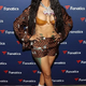 rin Cardi B flaunts her toned curves in skimpy gold bra and shorts for Fanatics Super Bowl party in Atlanta