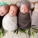 A playful and fun snapshot of a couple, surrounded by adorable little quadruplets and their older brother