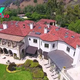 B83.Robbie Williams profited when he sold his large Beverly Hills mansion with 10 bedrooms and 22 bathrooms to rapper Drake for $50 million, seven years after buying it for $32 million.