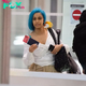 rin Cardi B rocks rainbow wig for flight to Italy… before joining nemesis Nicki Minaj at Milan Fashion Week