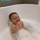 Happy bath time: The joy of a mother when seeing her child’s smile is a source of positive energy every day in life.